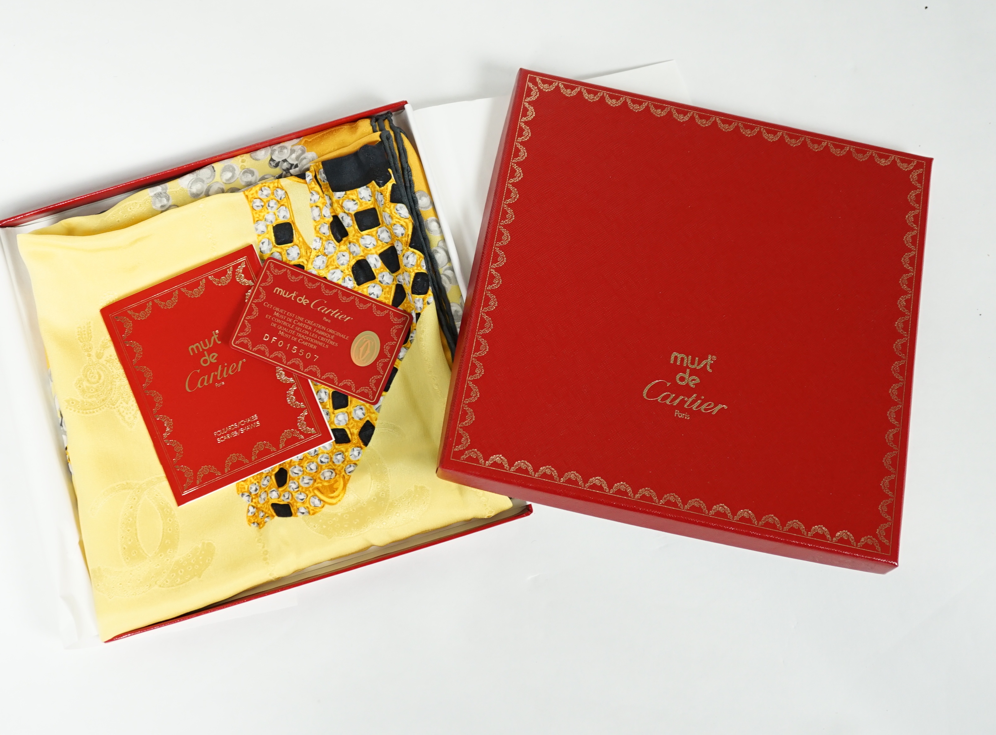 A Louis Vuitton, Cartier and Pucci boxed scarves